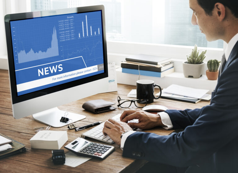 man-looking-stock-market-news-computer (1)